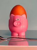 Pink Pig Egg Cup Still Life by Christopher Green