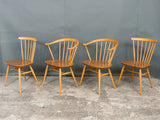 2 x Ercol Cowhorn Armchairs. 2 x Spindle Back Chairs