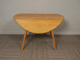 1960s Ercol Beech and Elm Oval Drop Leaf Dining Table 4 x Goldsmith Chairs
