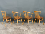 2 x Ercol Cowhorn Armchairs. 2 x Spindle Back Chairs